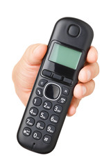 Hand with black cordless phone isolated