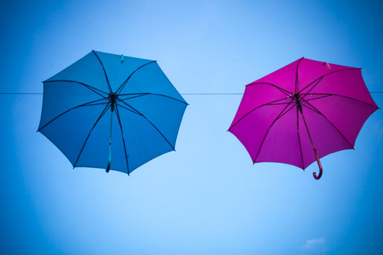 colorful umbrella on background of blue sky