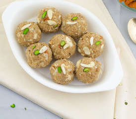 Indian Traditional Sweet Food Urad Dal Laddu Also Know as Laddoo, Ladoo, Laddo are Ball-Shaped Sweets Made of Butter, Dry Fruits, Fenugreek and other Spices. Urad Dal laddu Sweet Mostly Eat in Winter