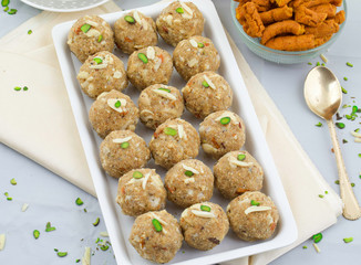 Indian Traditional Sweet Food Urad Dal Laddu Also Know as Laddoo, Ladoo, Laddo are Ball-Shaped Sweets Made of Butter, Dry Fruits, Fenugreek and other Spices. Urad Dal laddu Sweet Mostly Eat in Winter