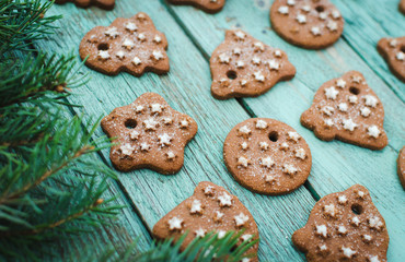 Christmas wooden background with cookies. Turquoise wooden table.