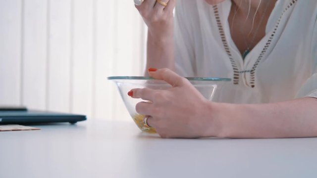 young woman taking a break for eating vegetable dinner