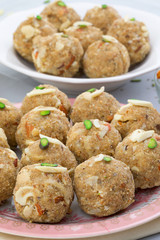 Indian Traditional Sweet Food Urad Dal Laddu Also Know as Laddoo, Ladoo, Laddo are Ball-Shaped Sweets Made of Butter, Dry Fruits, Fenugreek and other Spices. Urad Dal laddu Sweet Mostly Eat in Winter