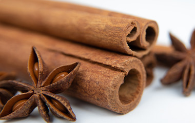 Cinnamon quills and star anise. Close up spicy set on white background