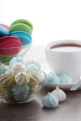 A cup of coffee and macaroons ready for breakfast