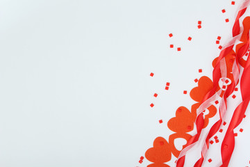 Background wit red ribbon and bright hearts for Valentine day decoration