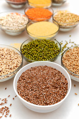 Bowls with healthy cereals on white background. Superfood.