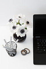 table with flowers and pen holder