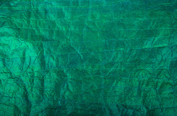 Green paper background. Crumpled paper background. Crumpled paper texture. Copy space
