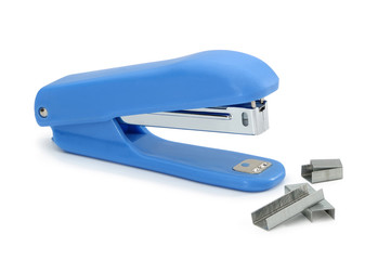 Blue stapler with metal brackets isolated on white background