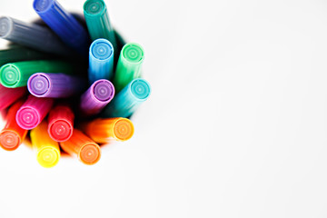  colorful pens on white background