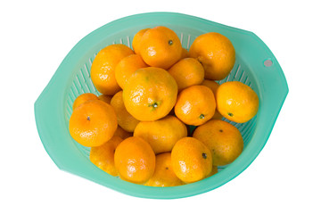 many orange in light green basket