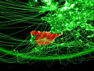 Spain on green model of planet Earth with network representing green age, travel and communication.