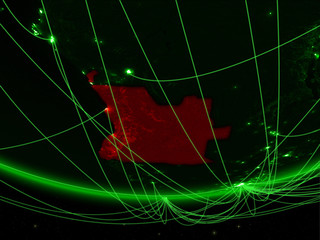 Angola on green model of planet Earth with network representing green age, travel and communication.