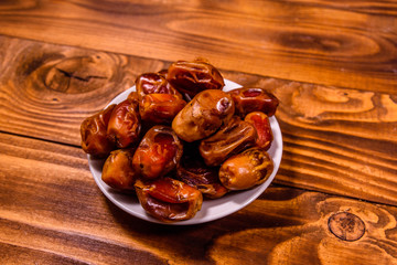 Date fruits on the rustic wooden table
