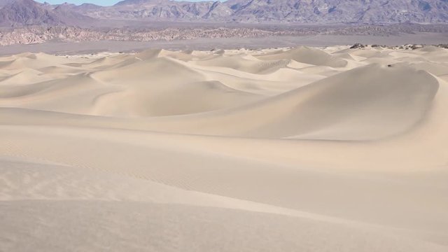 Death Valley Ca, Mesquite sand dunes pan left Mech Slider black sand patterns in foreground.mp4