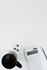 calculator and pen in white background