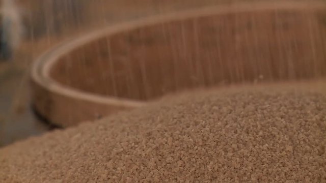 Close-up of sifting organic couscous grains in Morocco