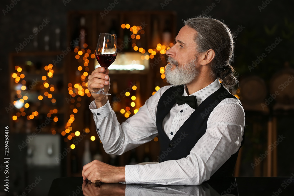 Canvas Prints Senior man drinking wine in bar