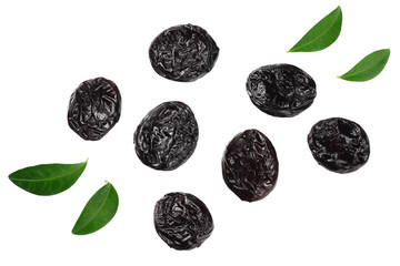 Dried plums - prunes with green leaves isolated on white background. top view