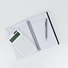 notebook and pen on white background