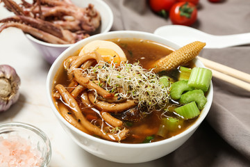 Tasty Chinese soup on light table
