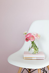 pink flowers on white chair