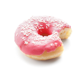 Tasty bitten doughnut on white background