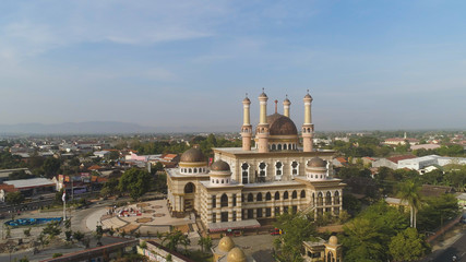 Fototapeta na wymiar beautiful mosque with minarets on island Java Indonesia. aerial view mosque in an asian city