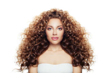 Beautiful woman with long healthy curly hair isolated on white. Wavy hairstyle, natural makeup,...