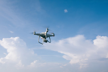 Fototapeta na wymiar Flying drone which taking photo over sea