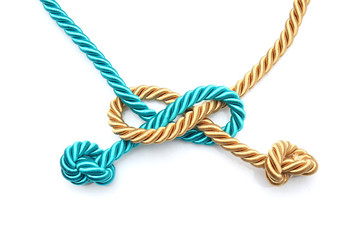 Tied ropes on white background