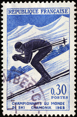 Illustration of skier on old french postage stamp