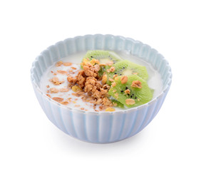 Tasty granola with yogurt in bowl on white background