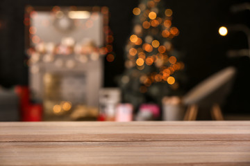 Wooden table against blurred interior of room