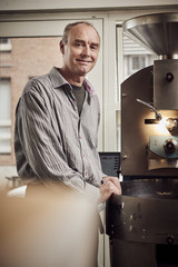 Barista roasting coffee beans 