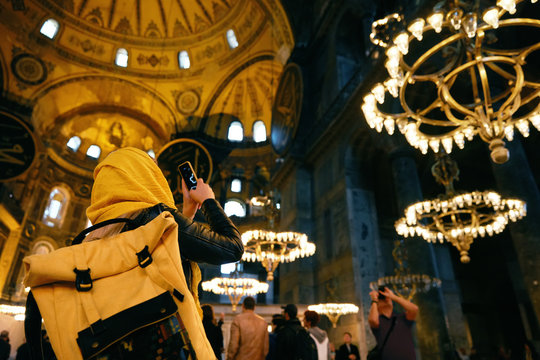 Woman In Hagia Sophia Cathedral Taking Photos On Phone