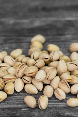 Pistachios on a grey wooden table