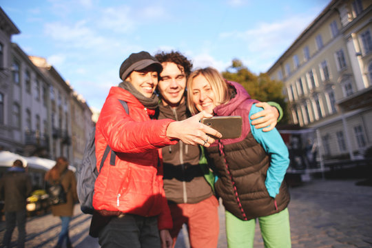 couple happy tourists making selfie on the streets of Lviv