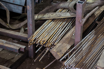 Rusty metal rods in stock