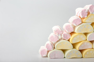 Tasty marshmallows on light background