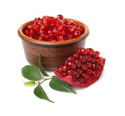 Bowl with pomegranate seeds  on white background