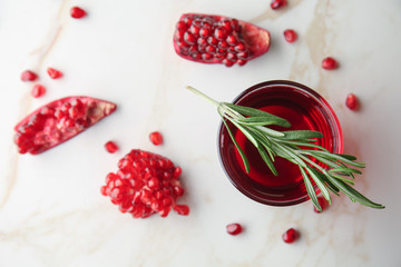 Glass of tasty pomegranate juice on table