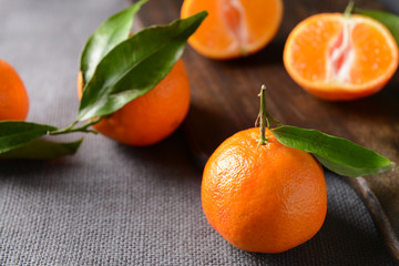 Tasty tangerines on grey table