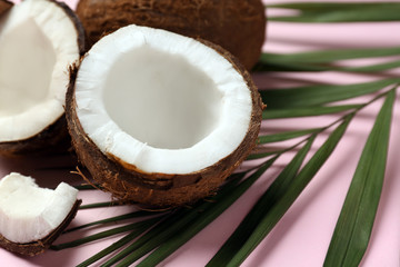 Cut ripe coconut on color background, closeup