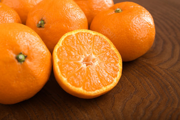Tasty tangerines on wooden background