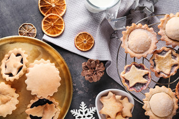 Composition with tasty mince pies on table