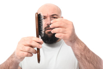 Man with hair loss problem on white background