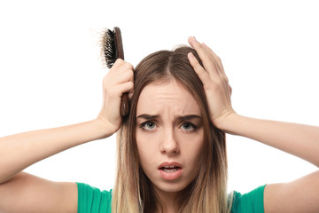 Woman with hair loss problem on white background