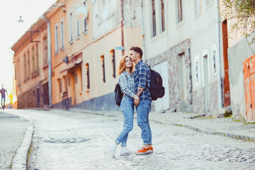 Obraz na płótnie Canvas Romantic couple embracing on the street of old city